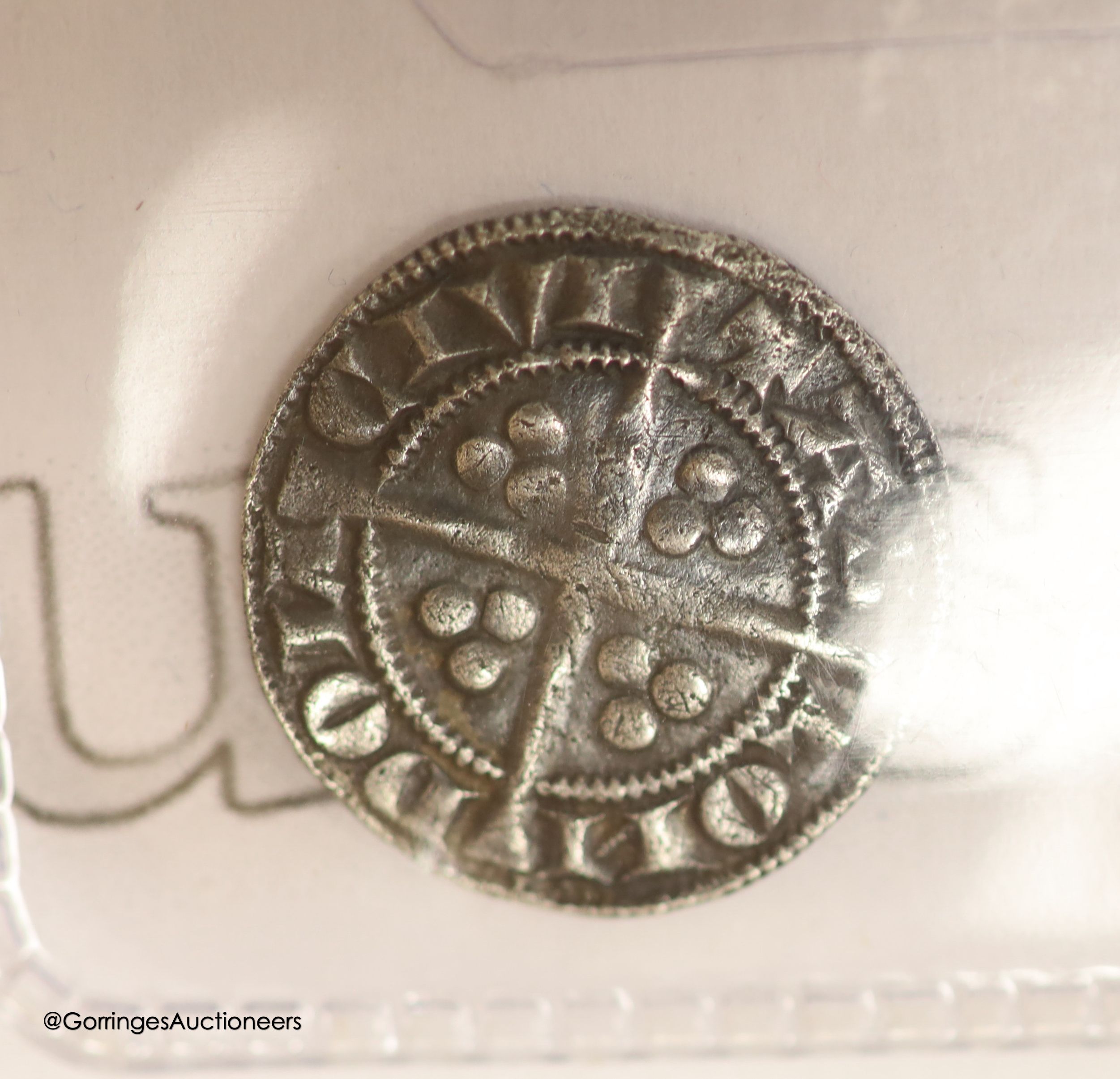 An Edward I silver penny, and Edward III half groat and a Charles I silver penny